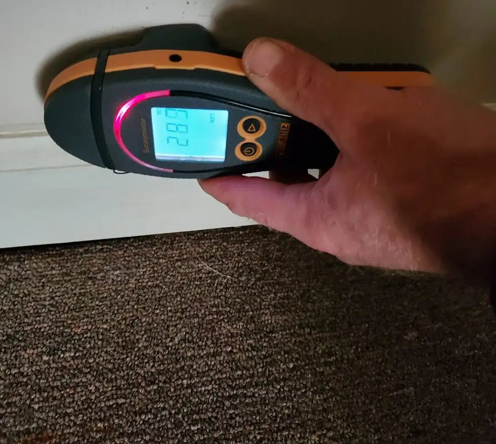 Moisture detection at baseboard during Storm Damage Restoration in Riverbank